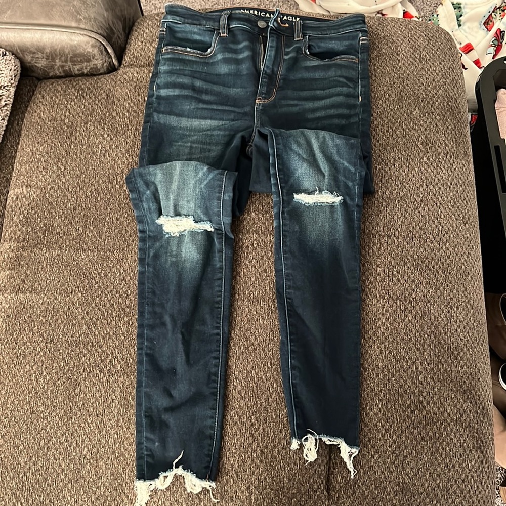 Dark blue American eagle ripped jeans.